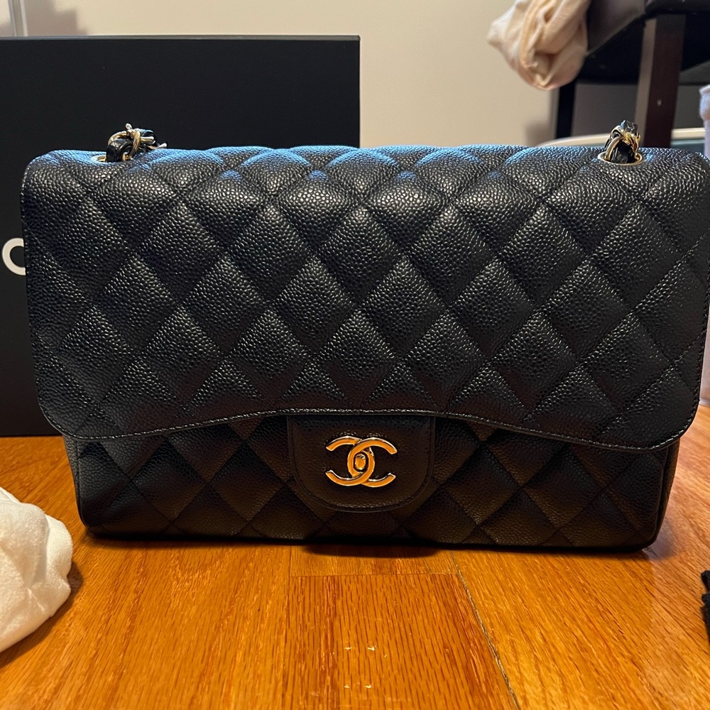 Chanel Black Jumbo Caviar Classic Double Flap with gold hardware